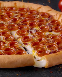 Our NEW Stuffed Crust Crispy Pepperoni and Bacon Pizza shall go down in history as the best to ever be! Crafted with three kinds of real, dairy-fresh California cheese and topped with perfectly curled pepperoni and hardwood-smoked bacon, ’tis truly magnificent. Order yours now at https://www.roundtablepizza.com/locations/. | Round Table Pizza