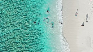 Beach front with children playing - Free Stock Video