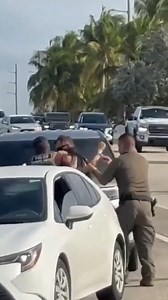 16K views · 83 reactions | Federal agents in Key Largo, Florida, forcibly removed a woman from her car during a traffic stop after she refused to roll down her window or provide her driver’s license, according to US Customs and Border Protection. Footage captured by a Miami Herald reporter shows the woman, dressed in medical scrubs, yelling “I’m a US citizen” as agents dragged her from the vehicle, handcuffed her, and searched her car. | New York Post Video | Facebook