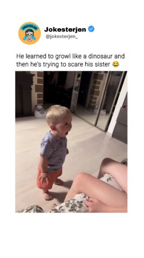 Humor | Memes | Funny | Culture on Instagram: "When your little brother thinks he's a T-Rex 🦖 and decides to give you a prehistoric scare! 😂 Watch out, Jurassic Park has nothing on this tiny terror! The video shows a young child standing on the floor, seemingly growling or making a roaring sound, while facing another person who is sitting on a bed. The child appears to be trying to scare the person on the bed, possibly a sibling, as suggested by the caption. The scene is set in a bedroom with 