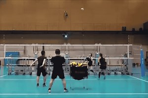 Japan's volleyball team test their spikes against robot blockers
