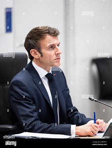 Paris, France. 25th Feb, 2022. French President Emmanuel Macron, second left, watches screen during a video-conference with NATO members at the French Army headquarters, in Paris, France on February 25, 2022. Photo by Eliot Blondet/ABACAPRESS.COM Credit: Abaca Press/Alamy Live News Stock Photo - Alamy