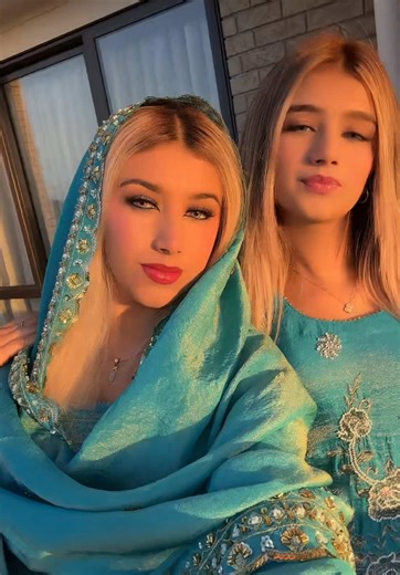 Traditional Attire Showcase: Intricate Teal Dresses