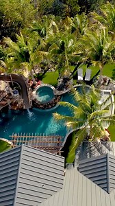 This backyard has an amazing slide, natural rock grotto, sunken fire pit, spa, putting green, and beautiful landscaping. What do you think of this backyard? #insanepools #lucaslagoons #poolbuilding #waterslide #backyardinspo #backyard #pool #luxurylife #luxuryhome | Lucas Lagoons Design