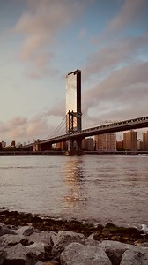 The Manhattan Bridge is an iconic suspension bridge that connects Brooklyn and Manhattan over the East River. Completed in 1909, it stretches 1,480 feet (451 meters) long and 102 feet (31 meters) wide, with a striking steel design that has become a symbol of New York City. The bridge’s four towers support two vehicle levels and a pedestrian/bicycle path, offering breathtaking views of the Manhattan skyline, the East River, and Brooklyn’s vibrant neighborhoods. As one of the busiest bridges in th