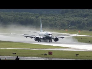 Boeing 737 MAX combat landing with spectacular reverse thrust on wet runway