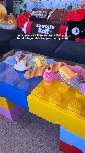 she’s ☻ elle on Instagram: "low key obsessed with building lego sets so we made a lego coffee table for our space earlier this year 💫 i get asked often how this thing doesn’t fall apart & we actually used c-clamps from home depot to hold the lego drawers together at the bottom so it’s super secure!! we also put plastic bumpers underneath the glass (which we got at ikea) so it stays in place 🫶 #lego #legotable #homedecor #livingroom #diy #colorfulhome #maximalistinteriors #interiordecor #coffee