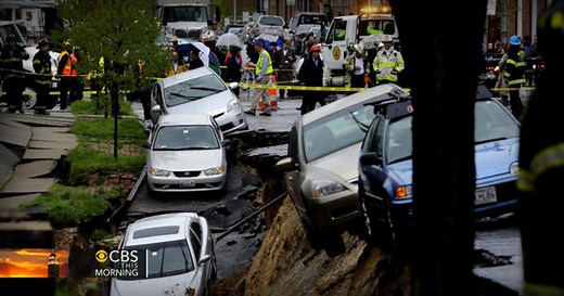 Street collapse in Baltimore sends parked cars tumbling