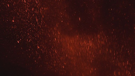 Burning lava particles leaping through the air - Free Stock Video