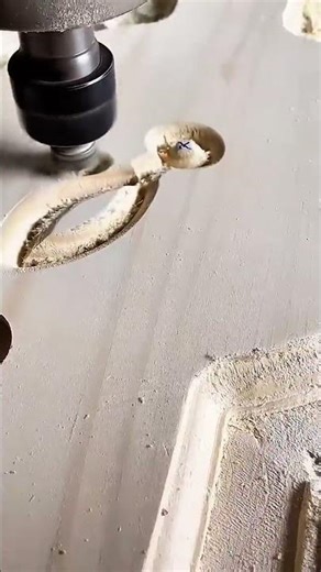 carving an intricate pattern into flat wooden board using precise and high speed cnc router machine
