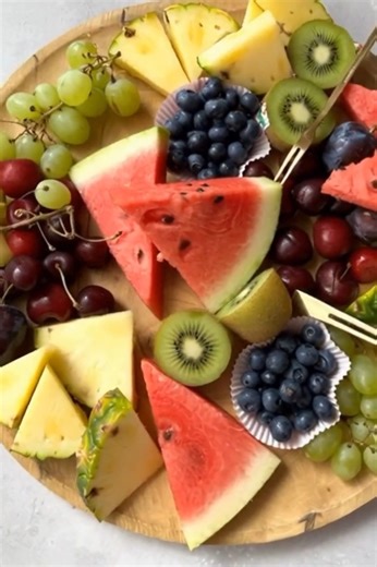 Summer Delight Fruit Platter Ingredients 2 cups watermelon slices 1 cup pineapple chunks 1 cup green grapes 1 cup red grapes 1 cup cherries 2 kiwis, peeled and sliced 1 cup blueberries Instructions Step 1: Wash and prepare all fruits. Step 2: Cut the watermelon and pineapple into wedges or bite-size pieces. Step 3: Slice the kiwis and arrange them around the platter. Step 4: Place cherries, grapes, and blueberries between the larger fruits for color balance. Step 5: Chill for 15–20 minutes befor