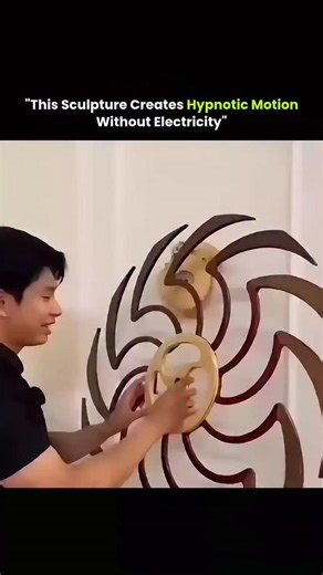 Wealth | Finance | Tech on Instagram: "This kinetic sculpture operates entirely on stored mechanical energy. A single twist activates an internal gear system that precisely controls the motion, allowing the wooden elements to rotate in smooth, continuous cycles. As multiple layers spin, their repeating geometric patterns overlap to form moiré illusions—visual waves that seem to ripple, pulse, and breathe. The motion is predictable and rhythmic, which naturally has a calming effect on the brain,