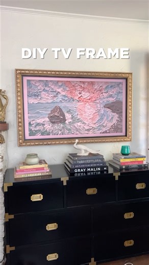 Bye-bye, boring TV! Add some pizazz with a decorative DIY frame. Follow along as @jennieandrews shows us how it’s done 💪 Here’s what you’ll need: -1x2 finish lumber -Decorative trim (slightly wider than your 1x2 pieces) -Miter saw -Brad nailer -Spray paint -Metallic wax finish How to make your own ⬇️ Step 1: Measure your TV (Project note: This frame was created for a Samsung Frame TV. Steps and measurements will need to be adjusted for other TVs.) Step 2: Cut the 1x2s at 45 degrees to fit the o