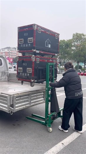 A compact forklift with adjustable-width forks. Maneuverable, portable, and handles 300kg with ease.