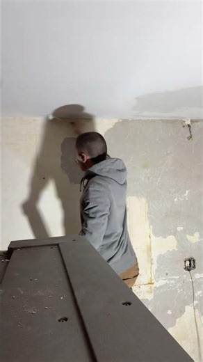 Sanding the ceiling on a patch so that we can paint mold killer over it