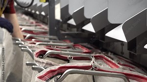 Staff working at the automated parcel sorting system filling bags