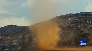 A strong dust devil sweeps along the summit of Marum Volcano on the Pacific island of Vanuatu | The Weather Channel