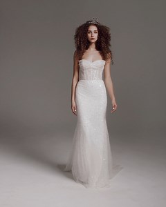 This ultra-feminine #VeraWangBride wedding dress features a draped corset bodice bathed in hundreds of sparkly beads and sequins detailing throughout the entire gown with a fitted fishtail skirt. https://bit.ly/3UKgNrs | Designer Bridal Room, Hong Kong