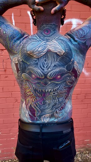 Stunning Back Tattoo Completion with Blackout Technique