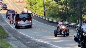 A large funeral procession carried Corey Comperatore, the man killed while shielding his family during the Trump rally shooting. | USA TODAY
