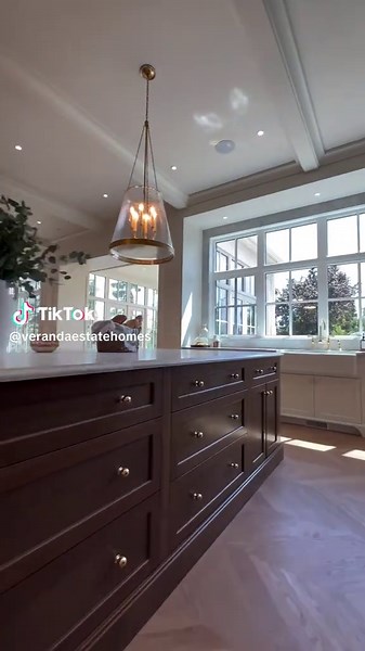 Walking in from the mudroom, this kitchen is pure magic. That 11-foot island is a showstopper—rich white oak handcrafted cabinetry grounded by the marble countertop, with brass accents adding just enough sparkle. The natural light floods in, bringing everything to life and making the whole space feel warm and inviting. This is what coming home should feel like—effortless beauty, designed to be lived in. #kitchen #kitchendesign #dreamhome #housegoals #luxuryliving #interiordesign