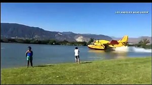 FIRE 'SUPER SCOOPERS" IN ACTION! Watch as this LA County Fire aircraft turns to the local Santa Fe Dam to gather water to fight the Montebello 'Lincoln' fire that burned through 225 acres over the weekend. Check out our full story: http://www.myfoxla.com/story/29798921/crews-battling-brush-fire-in-montebello | FOX 11 Los Angeles