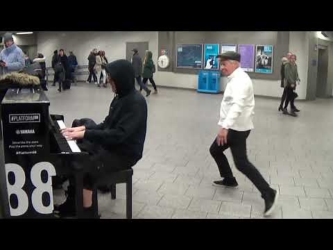 Duelling Pianos In A London Station