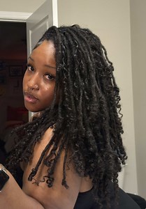 Styling Locs: Embracing Curls for a Chic Look