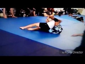Jr High school girl defeats stronger man in jiu-jitsu match.