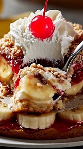 Banana Split Dump Cake Recipe Ingredients: - 3 ripe bananas, sliced - 1 can (20 oz) crushed pineapple, drained - 1 can (21 oz) cherry pie filling - 1 box (15.25 oz) yellow cake mix - 1/2 cup (1 stick) unsalted butter, melted - 1/2 cup chopped walnuts - 1/2 cup semisweet chocolate chips - Whipped cream (for serving, optional) - Maraschino cherries (for garnish, optional) Directions: 1. Preheat the oven to 350°F (175°C). Grease a 9x13-inch baking dish. 2. Layer the sliced bananas evenly on the bot