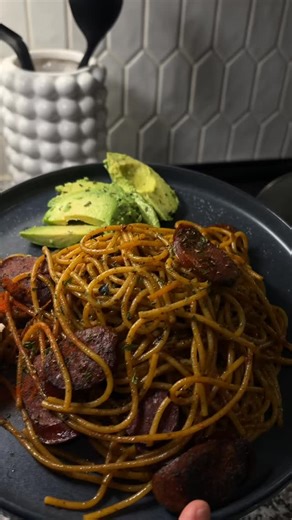 Haitian Spaghetti is a beloved twist on classic spaghetti full of bold flavors and a bit heartier than the Italian version. It’s a staple in Haitian homes and often served at family gatherings, birthdays, or special occasions. | @tatyyrene on Instagram. | Discover Haitian Cuisine