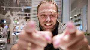 Emotional man screaming in camera. Man emotionally saying something. Angry person. Point-of-view shot.