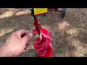 Earthquake auger with outrigger system assembled