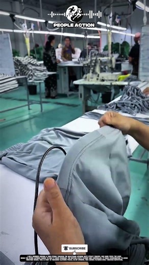 Garment People inserting waistband string during action 🧵