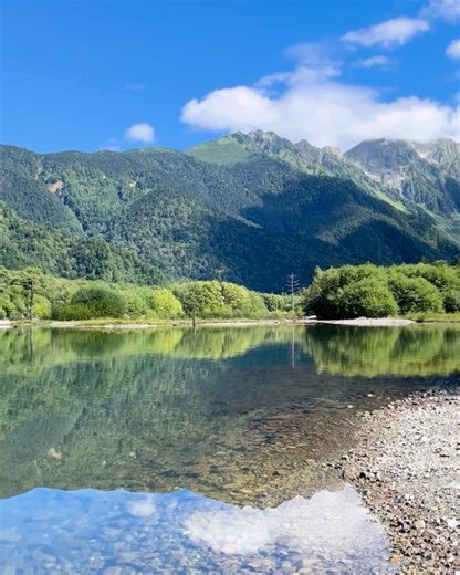 Sakura Journey Club🌸|Japan Travel Media✈️🇯🇵 on Instagram: "Explore the Magic of Kamikochi, Japan Kamikochi is one of Japan’s most breathtaking mountain valleys, and these photos capture two of its most peaceful and iconic spots. If you love quiet lakes, crystal-clear rivers, and untouched nature, this place belongs on your Japan itinerary. 🌿🏔 1. Taisho Pond (Photos 1 & 2) This calm, mirror-like pond was formed after a volcanic eruption in 1915, and today it reflects the Hotaka Mountains lik