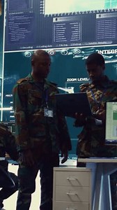 Vertical Video Army commanders overseeing field operations with real time data registered on surveillance CCTV systems. Military officials examining mission details, army defense program in power base