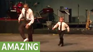 Tap dance-off between toddler and seasoned pro.