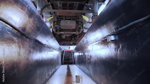Bottom view of the truck from the service station inspection pit. Bright, clean equipped inspection pit
