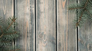 Stop motion video of white opening envelope on gray wooden background with branches of Christmas tree. Kraft paper card is taken out of new year envelope and opened. Copy space. Top view