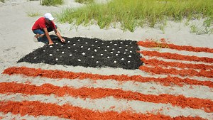 Timelapse: Watch a giant American flag being made in the sand in Cocoa Beach