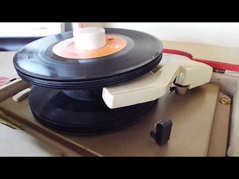 Automatic 45 Record changer playing a stack of 45 RPM records.