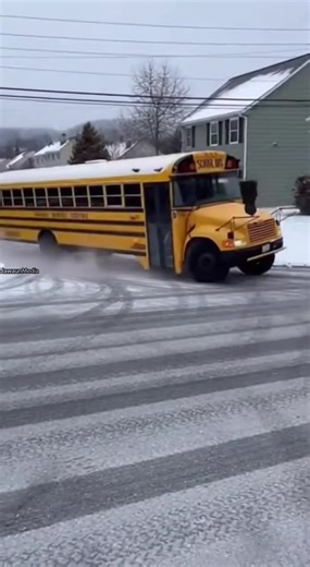 Icy Hill Sends School Bus Crashing Into Garage 🚸 Altoona, Pennsylvania — Thursday, Winter 2025 Raw smartphone footage captures a school bus losing traction on a frozen hill and sliding backward at speed. The driver loses steering, and the bus crashes into a residential garage, disappearing halfway into the structure. Officials later confirmed only minor injuries were reported, and no students were harmed. Investigators warned that steep icy streets can overpower large vehicles. How would you re