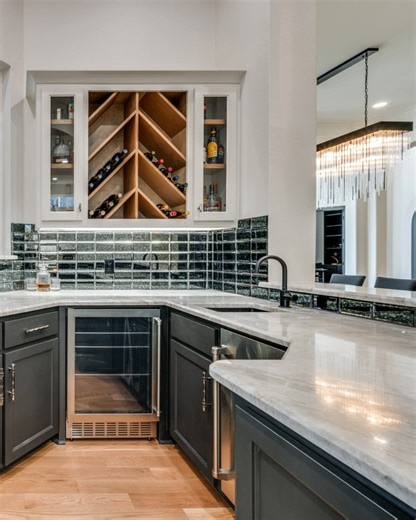 A thoughtfully designed wet bar becomes more than a feature. It’s a natural gathering place for hosting, celebrating, and unwinding, bringing warmth and intention to the heart of the home. Discover what thoughtful design can do for your space: https://shorturl.at/0YS61 #DFWImproved #HomeRemodeling | DFW Improved