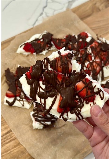 Who needs flowers when you can make thjs chocolate covered strawberry yogurt bark for your valentine. 1 cup vanilla Greek yogurt 1 cup washed and sliced strawberries 1/2 cup melted chocolate(melt chocolate chips in 30 second increments in the microwave stirring in between until the chocolate is fully melted) On a parchment lined sheet pan spread the Greek yogurt into an even layer top with the sliced strawberries and drizzle melted chocolate on top place into the freezer until the yogurt has set