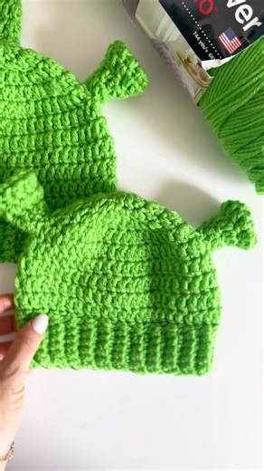 We are simply green with envy at whoever ends up with these gifted ogre hats 💚 Photos & stitching by: Repeat Crafter Me Yarn: Red Heart Super Saver #Shrek #CrochetHat | Yarnspirations