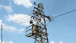 Electric pole with power lines. Electricity transmission. Transformer on utility pole.