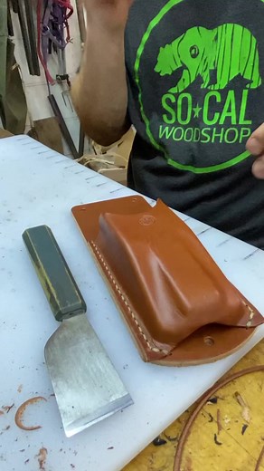 I sure do enjoy flush trimming leather edges with a skiving knife. The edges come out clean and crisp and ready for edge dye. I prefer a smooth edge from a blade as opposed to one from sanding. Sanding leaves the edges fuzzy since the grit is abrading the leather fibers. A sharp skiving knife severs those fibers and leaves a surface behind that is as smooth as you could ever need. I’ve got several of these skiving knives from Weaver Leather Supply and I think they are top notch. The steel takes 