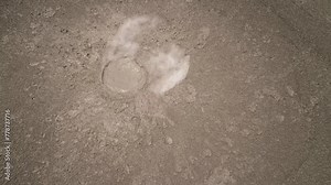 Mud volcano with bursting bubble bledug kuwu, slow motion. aerial view volcanic plateau with geothermal activity and geysers, Indonesia java. aerial view volcanic landscape