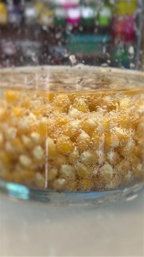 Things are about to get poppin' with this experiment. 🍿 Make some dancing popcorn! This science experiment produces carbon dioxide (CO2) gas when different chemicals are mixed together. The gas that is formed makes the popcorn kernels rise to the surface of the liquid. The kernels fall back toward the bottom of the liquid when the gas is released. The up-and-down motion of the kernels makes it appear that the popcorn is, as the name of the experiment implies, dancing! 💃 | WeAreTeachers