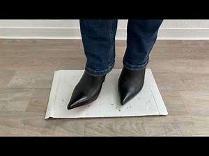 Metal heels pierce cardboard